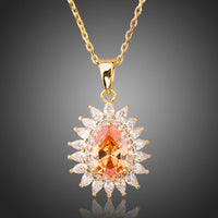 KHAISTA champagne CZ sunflower pendant necklace on white background