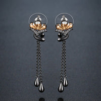 KHAISTA champagne crystal flower drop earrings on white background