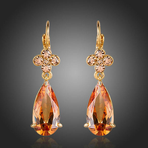 KHAISTA champagne flower CZ hanging earrings on white background