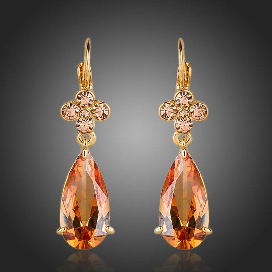 KHAISTA champagne flower CZ hanging earrings on white background