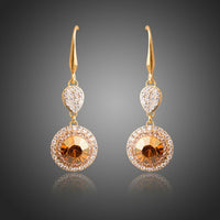 KHAISTA champagne round crystal drop earrings on white background