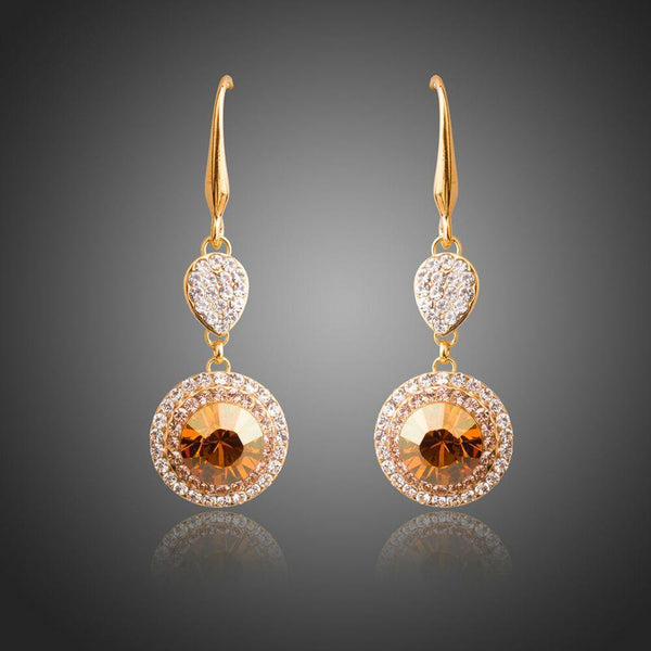 KHAISTA champagne round crystal drop earrings on white background