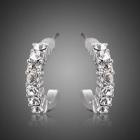 KHAISTA classic crystal stud earrings on white background