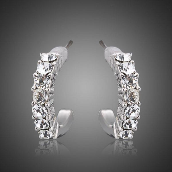 KHAISTA classic crystal stud earrings on white background