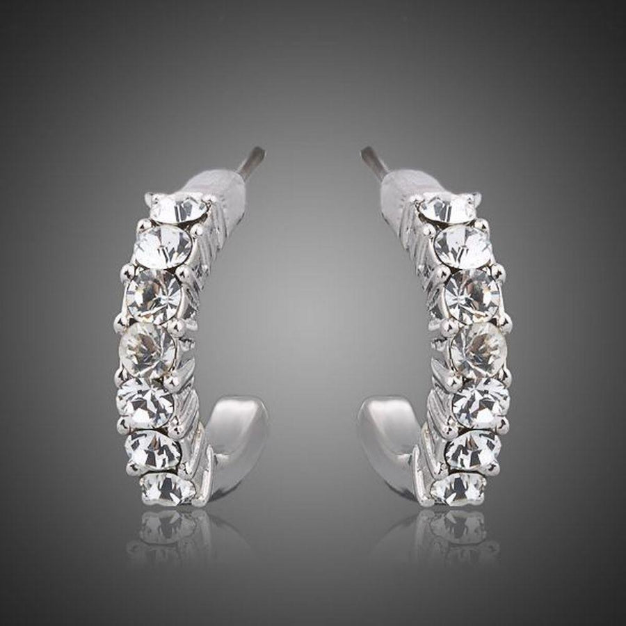 KHAISTA classic crystal stud earrings on white background