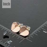classic gold heart stud earrings detail view by KHAISTA