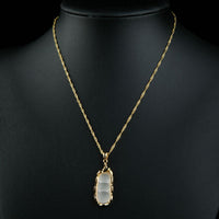 Close up detail of KHAISTA classic gold chain necklace