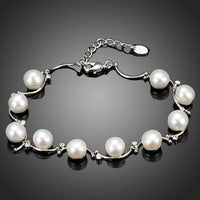 KHAISTA classic milk white crystal pearl bracelet on white background