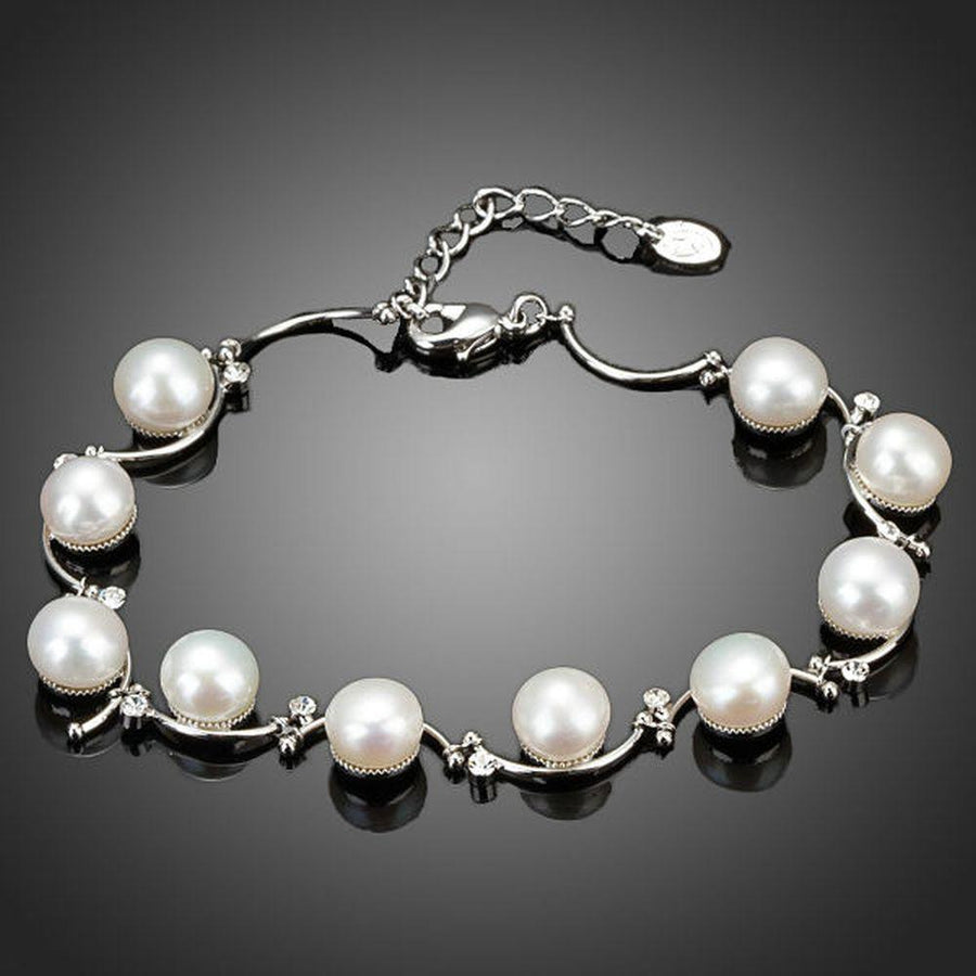 KHAISTA classic milk white crystal pearl bracelet on white background