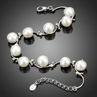 Close up detail of KHAISTA classic milk white crystal pearl bracelet