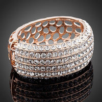 Close up detail of KHAISTA classic rose gold cuff bangle