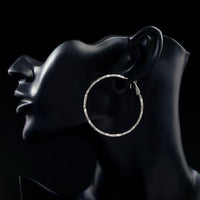 Close up of KHAISTA classic round crystal hoop earrings
