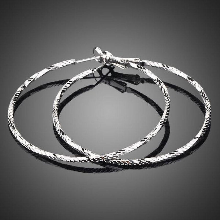 KHAISTA classic round crystal hoop earrings on white background