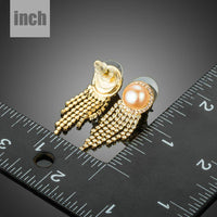 claw chain pearl earrings detail view by KHAISTA