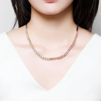 Side angle view of KHAISTA clear CZ long pendant necklace