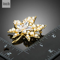 Close-up of CZ stones on Khaista maple leaf brooch