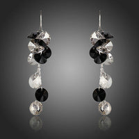 KHAISTA cluster crystal drop earrings on white background