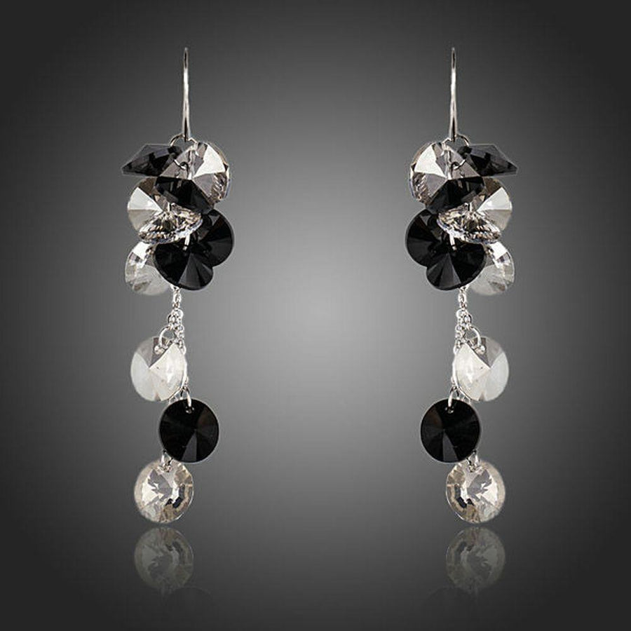 KHAISTA cluster crystal drop earrings on white background