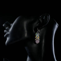 Side angle view of KHAISTA cluster gradient bunch crystal drop earrings