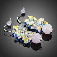 Close up of KHAISTA cluster gradient bunch crystal drop earrings