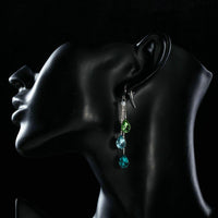 Side angle view of KHAISTA colour raindrop crystal drop earrings