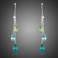 KHAISTA colour raindrop crystal drop earrings on white background