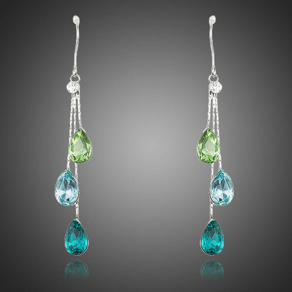KHAISTA colour raindrop crystal drop earrings on white background