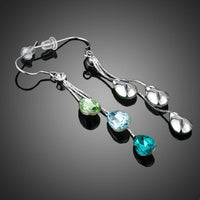Close up of KHAISTA colour raindrop crystal drop earrings
