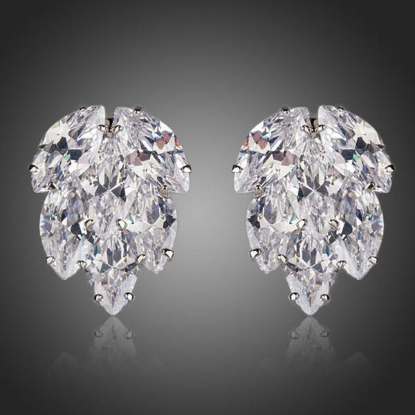 KHAISTA coupled CZ cluster stud earrings on white background