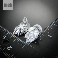 coupled CZ cluster stud earrings detail view by KHAISTA