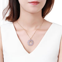 Close up detail of KHAISTA crown heart hollow round pendant necklace