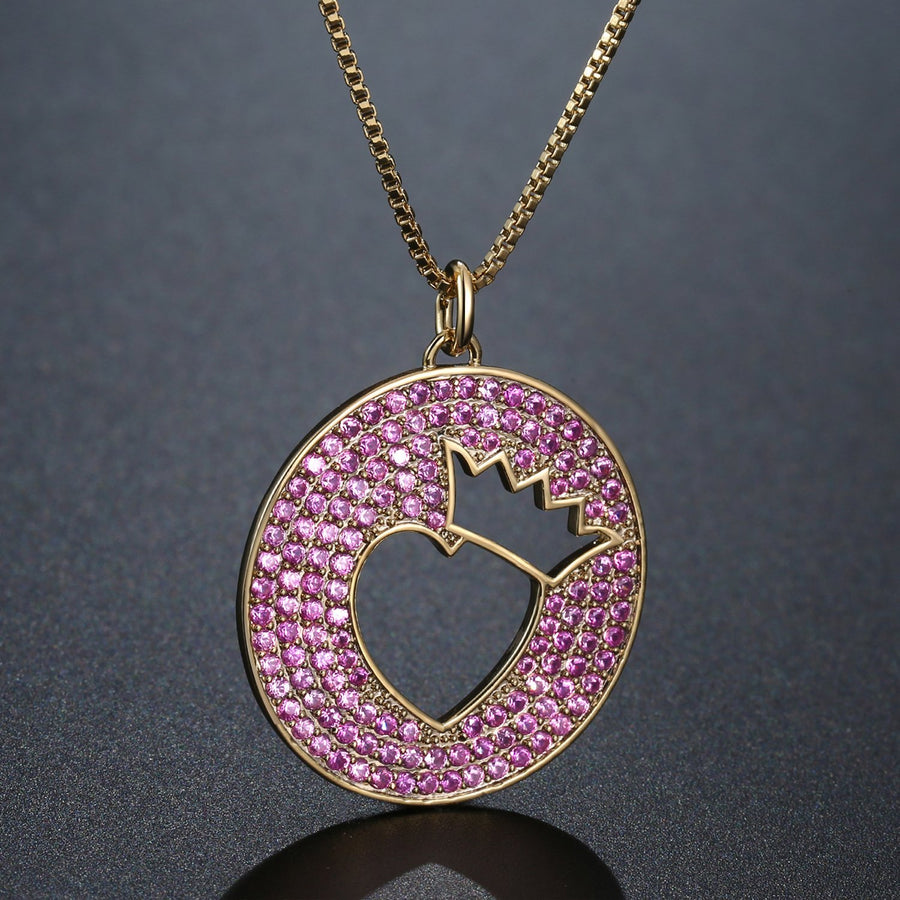 KHAISTA crown heart hollow round pendant necklace on white background