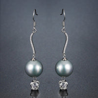 crown pearl drop earrings detail view by KHAISTA