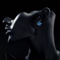 Side angle view of KHAISTA crystal blue square stud earrings