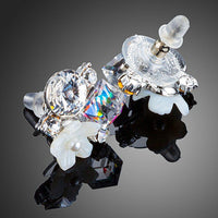 Close up of KHAISTA crystal bouquet stud earrings