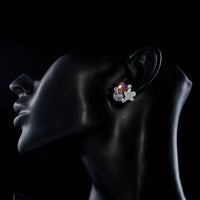 Side angle view of KHAISTA crystal bouquet stud earrings