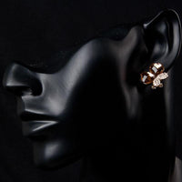 Wing detail on KHAISTA crystal butterfly earrings