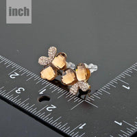 Close up of KHAISTA crystal butterfly gold wings