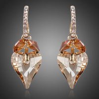KHAISTA caramel crystal heart drop earrings on white background