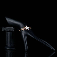 Side angle view of KHAISTA crystal flower link chain bracelet