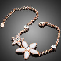 Close up detail of KHAISTA crystal flower link chain bracelet