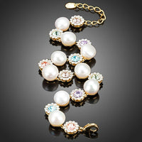 Close up detail of KHAISTA crystal flower stud pearl bracelet