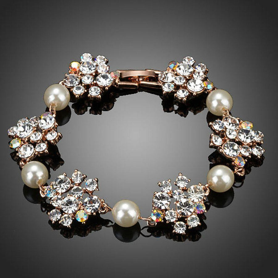 KHAISTA crystal flowers pearl bracelet on white background