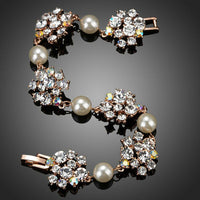Close up detail of KHAISTA crystal flowers pearl bracelet
