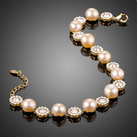 Close up detail of KHAISTA crystal flower pearl chain bracelet