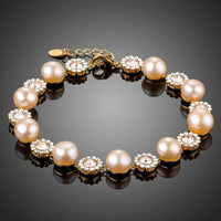 KHAISTA crystal flower pearl chain bracelet on white background