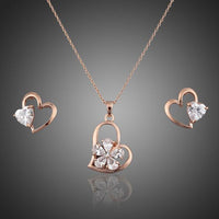 Khaista crystal heart stud earrings necklace set on white background