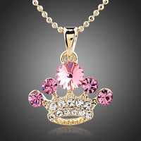 KHAISTA pink crystal crown pendant necklace on white background