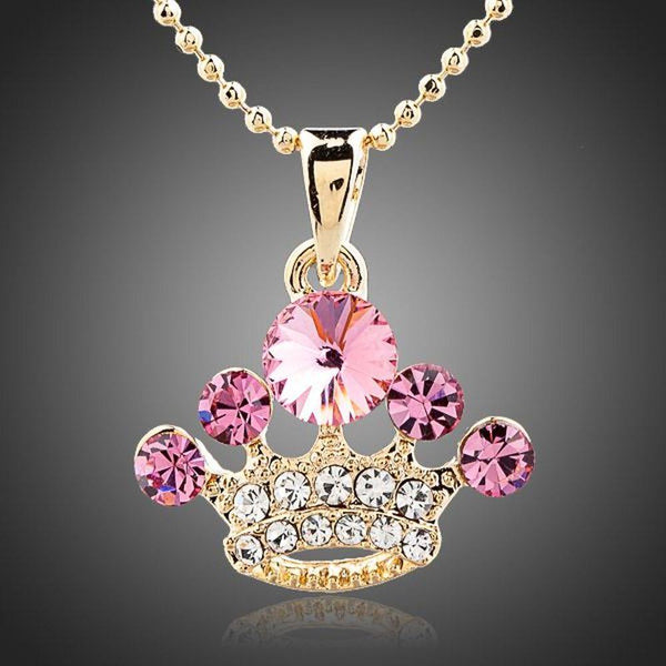 KHAISTA pink crystal crown pendant necklace on white background