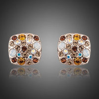KHAISTA crystal stars stud earrings on white background